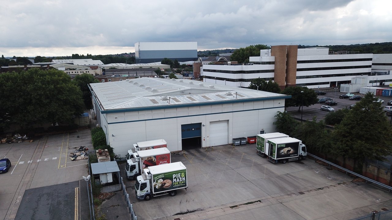 Warehouse and yard at Sidcup with delivery vehicles.